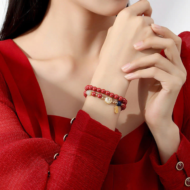 Zinnoberarmband mit Fu-Charakter und Tridacna-Stein
