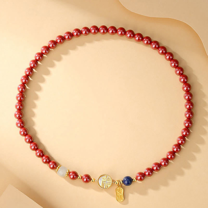 Zinnoberarmband mit Fu-Charakter und Tridacna-Stein