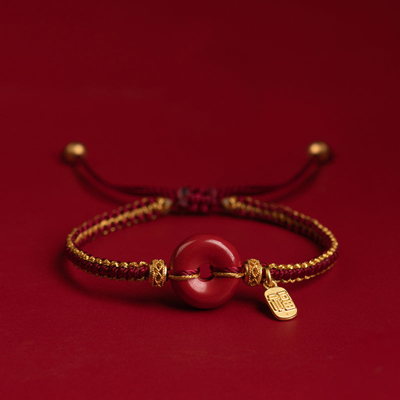 Geflochtenes Zinnoberarmband mit Peace-Schnalle und Fu-Anhänger