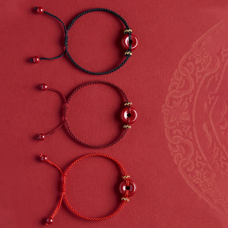 Zinnober-Armband mit Friedensschnalle und geflochtener Schnur zum Schutz