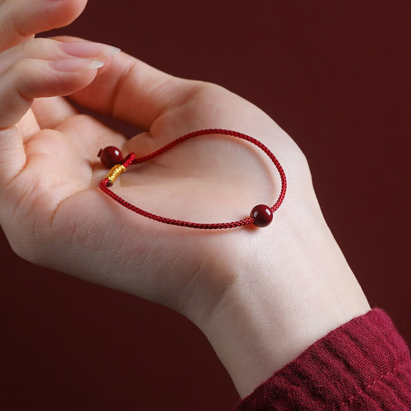 Segensarmband aus Zinnober und rotem Achat mit roter Schnur