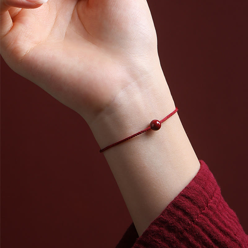 Segensarmband aus Zinnober und rotem Achat mit roter Schnur