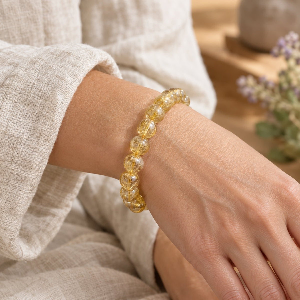 10mm Citrine Bracelet for Happiness & Prosperity, worn on the wrist by a woman