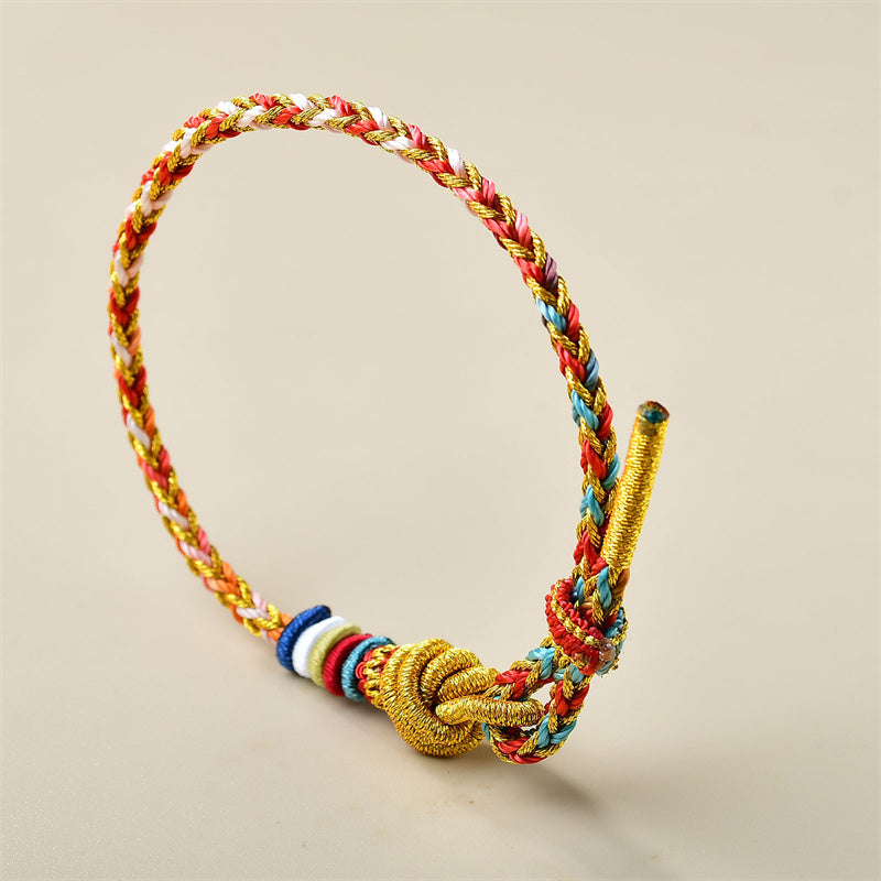 Buntes goldrotes Schnurarmband für Heilung und Gleichgewicht