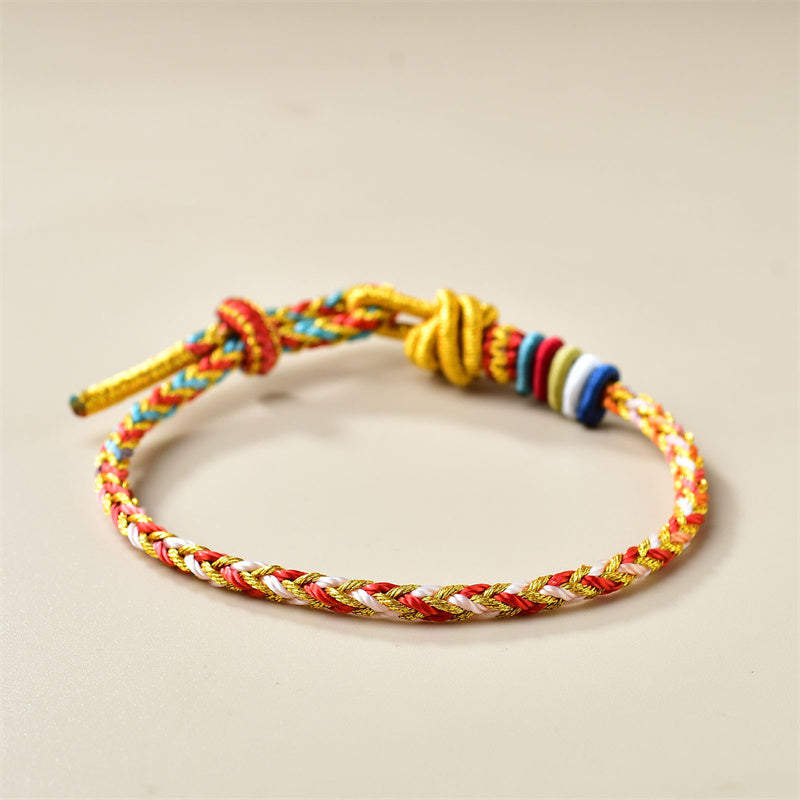 Buntes goldrotes Schnurarmband für Heilung und Gleichgewicht