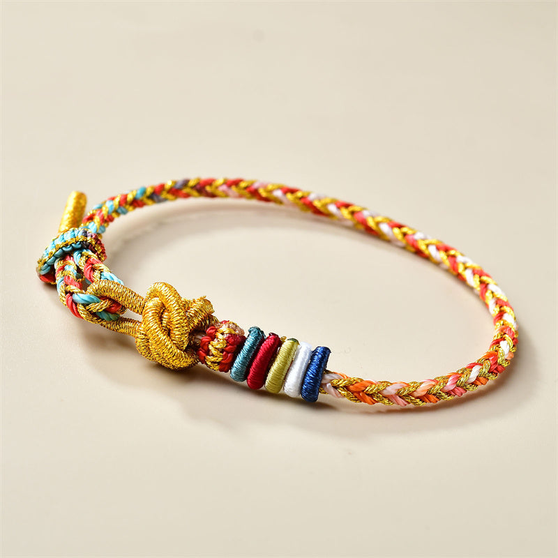 Buntes goldrotes Schnurarmband für Heilung und Gleichgewicht