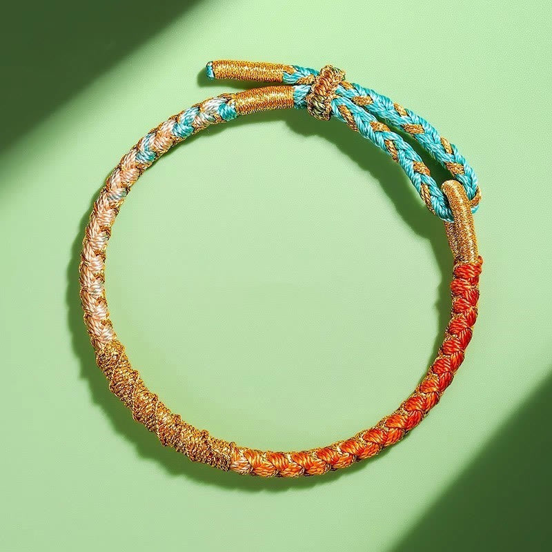 Buntes Goldfaden-Armband mit tibetischem Drachenschuppenknoten und roter Schnur