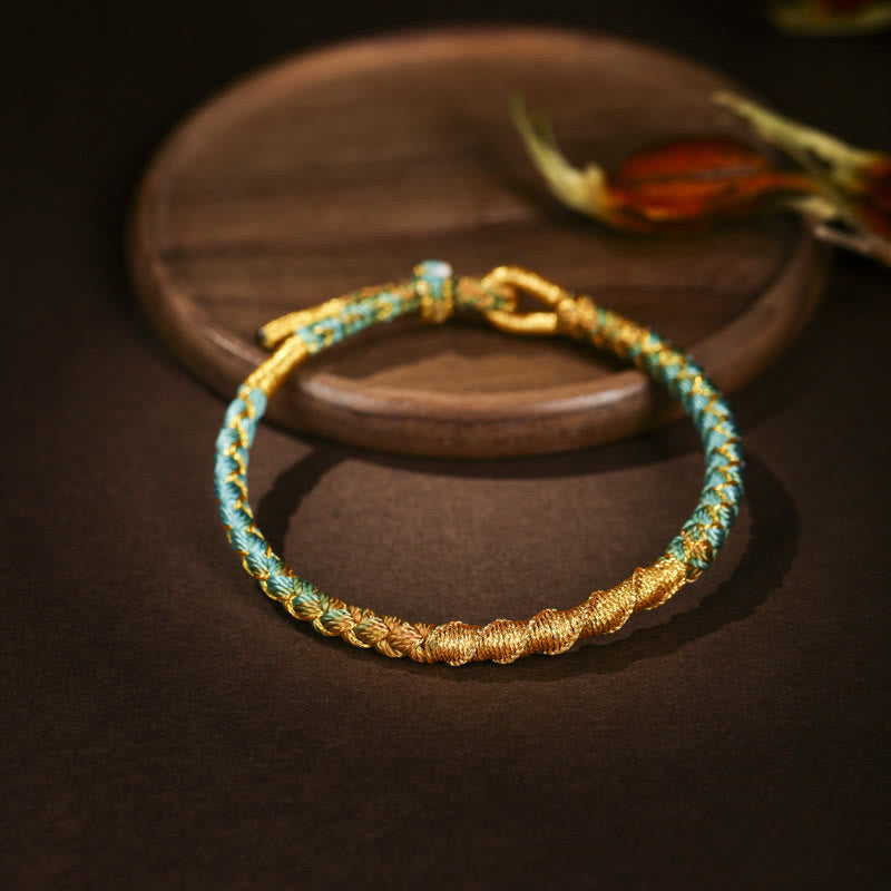 Buntes Goldfaden-Armband mit tibetischem Drachenschuppenknoten und roter Schnur