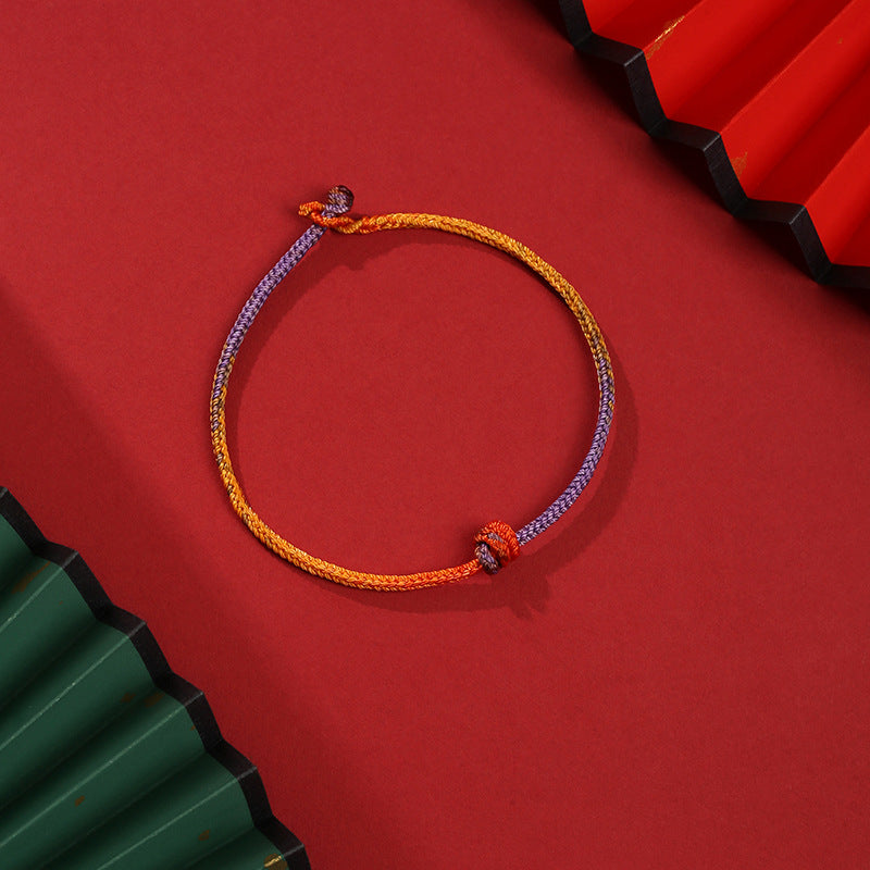 Buntes lila-goldrotes geflochtenes Seilarmband für Balance