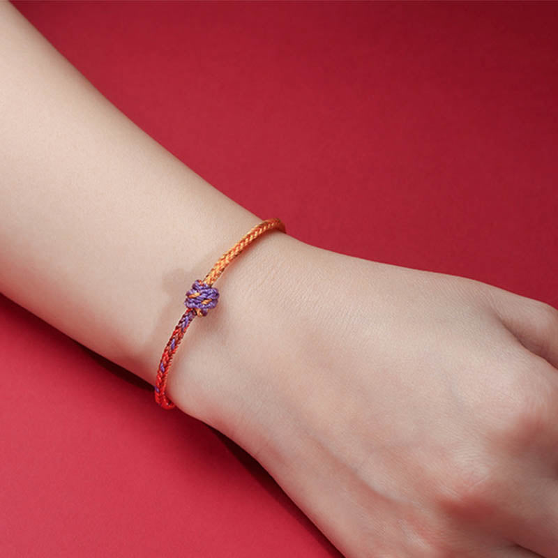Buntes lila-goldrotes geflochtenes Seilarmband für Balance
