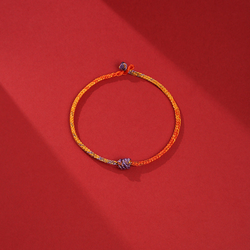 Buntes lila-goldrotes geflochtenes Seilarmband für Balance