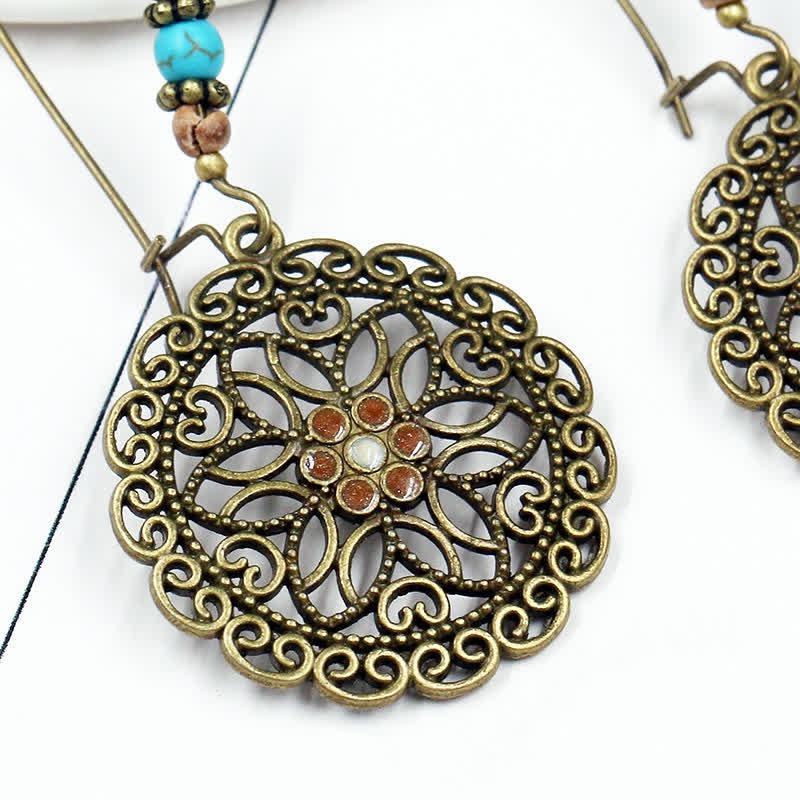 Spirituelle Kupferohrringe mit Blumendesign für Glück und Fülle