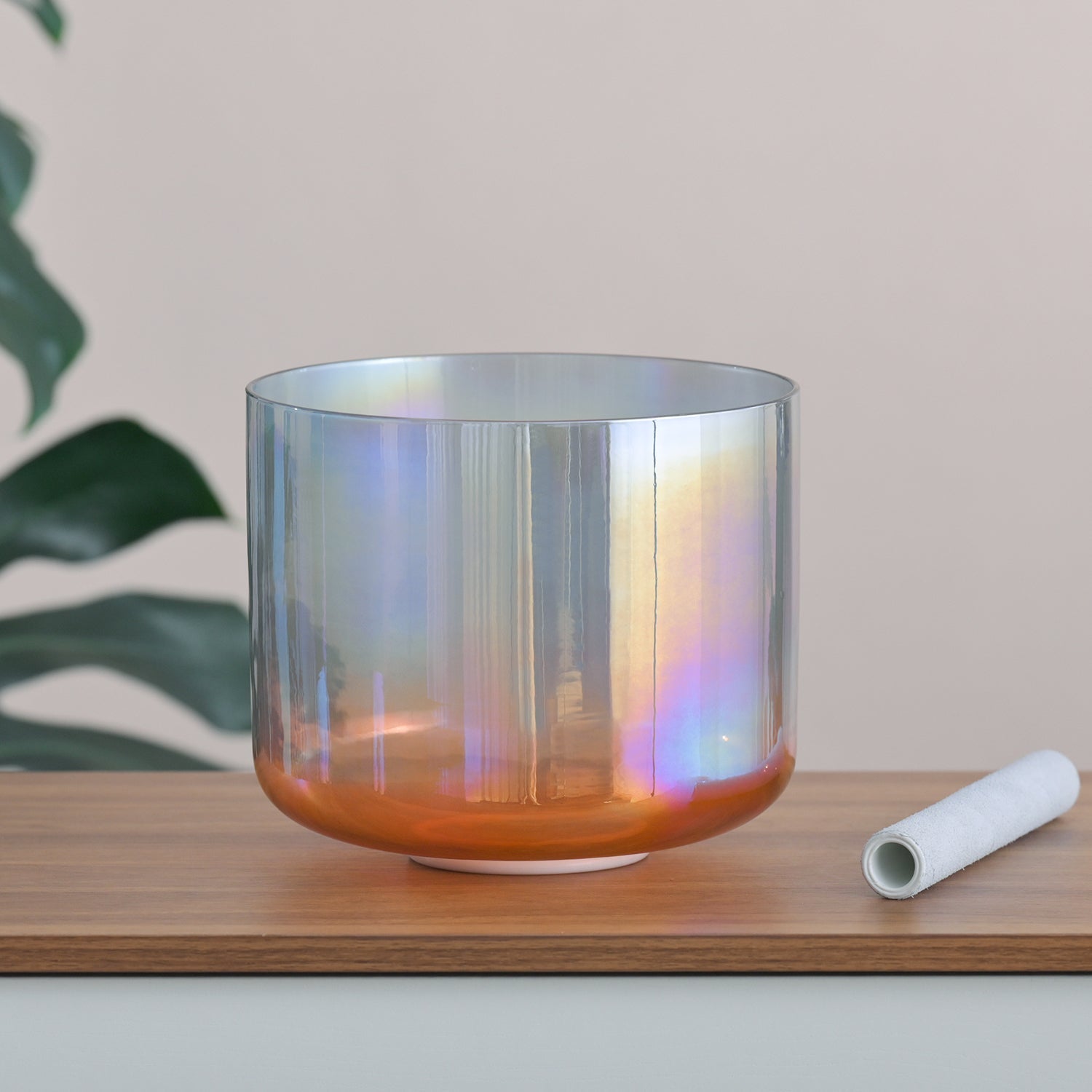 Iridescent Crystal Singing Bowl with orange base for sound healing and meditation