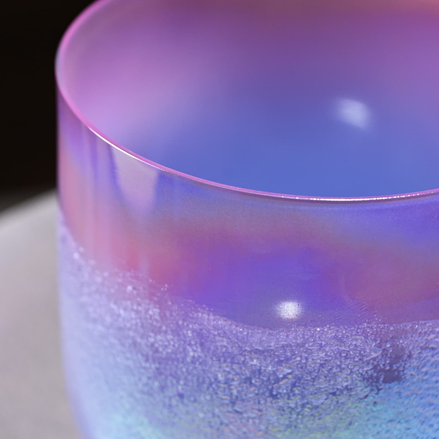 Frosted glass cup with iridescent purple and blue hues for Crystal Singing Bowl