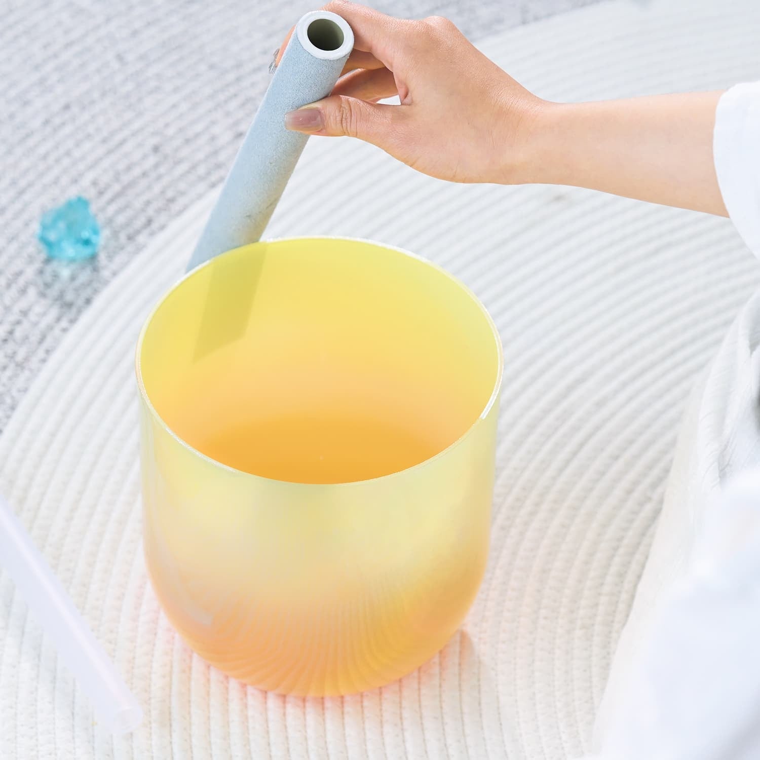 Yellow-orange frosted glass singing bowl with gradient for sound healing and meditation