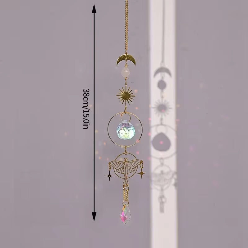 Decorative hanging crystal suncatcher featuring gold celestial moon and star designs