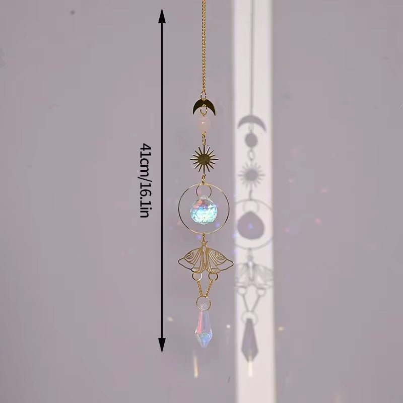 Decorative hanging crystal suncatcher with golden moth and star accents for outdoor decor