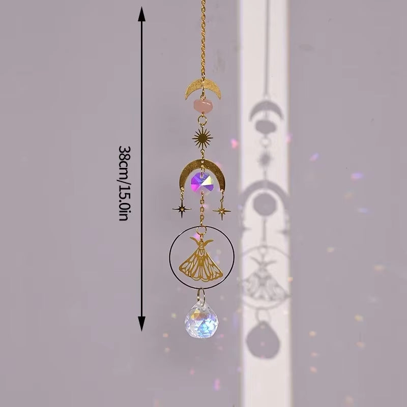 Decorative hanging crystal suncatcher with golden moons, stars, and tassel design