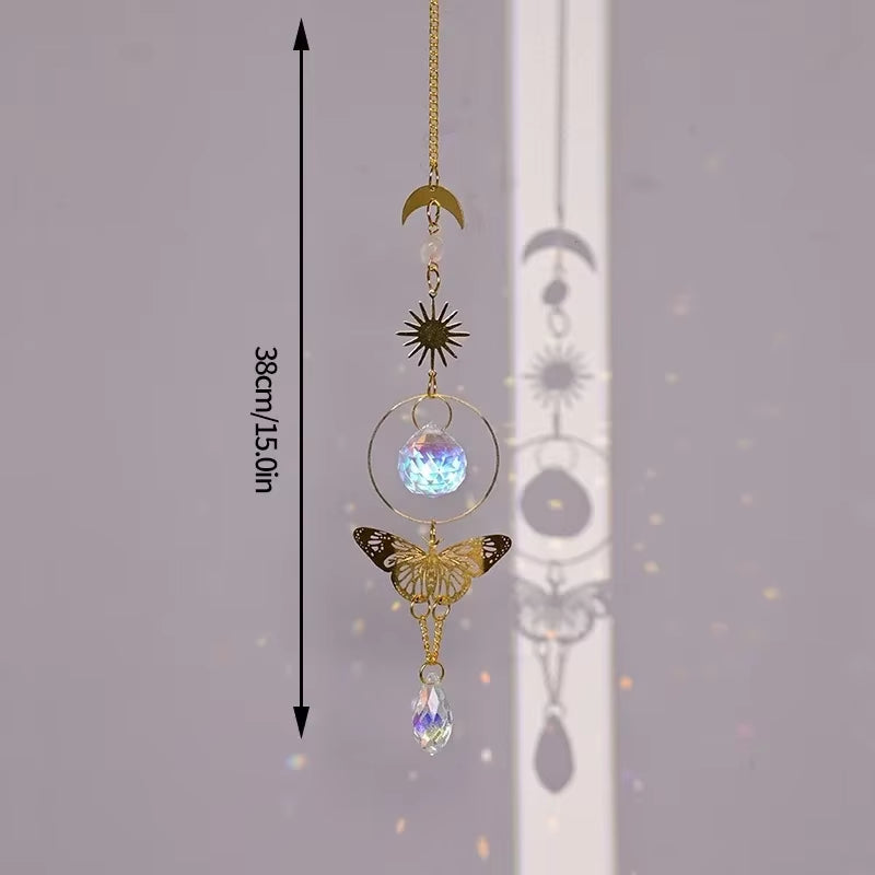 Decorative hanging crystal suncatcher with golden butterfly, moon, and star charms