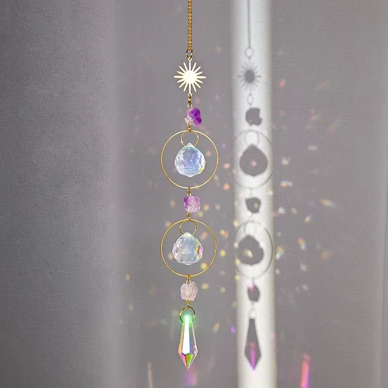 Hanging crystal suncatcher with gold wire circles and colorful gemstones for outdoor decor
