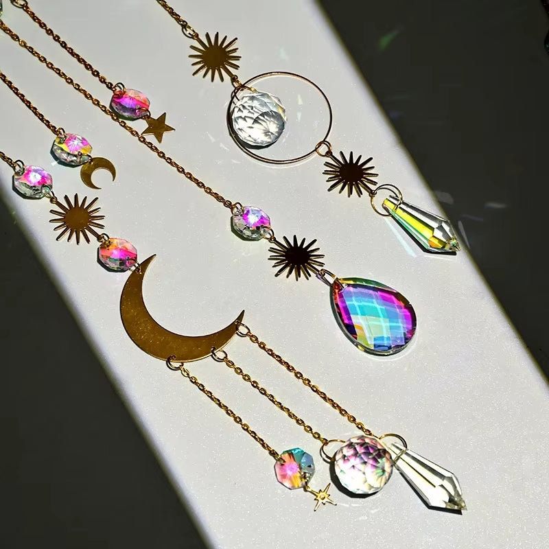 Celestial-themed crystal and metallic necklaces with moon, star, and sun motifs