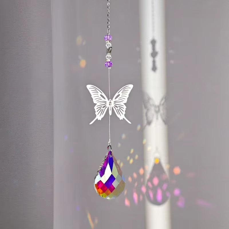 White butterfly suncatcher with purple beads and rainbow crystal pendant for outdoor decor