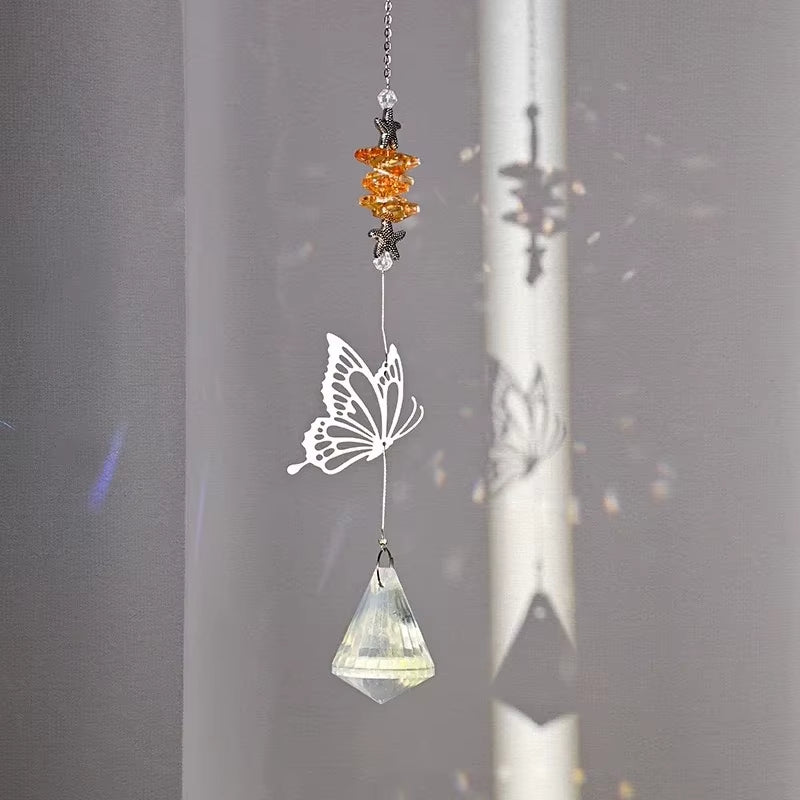 Hanging crystal suncatcher with white butterfly and orange beads for outdoor beauty