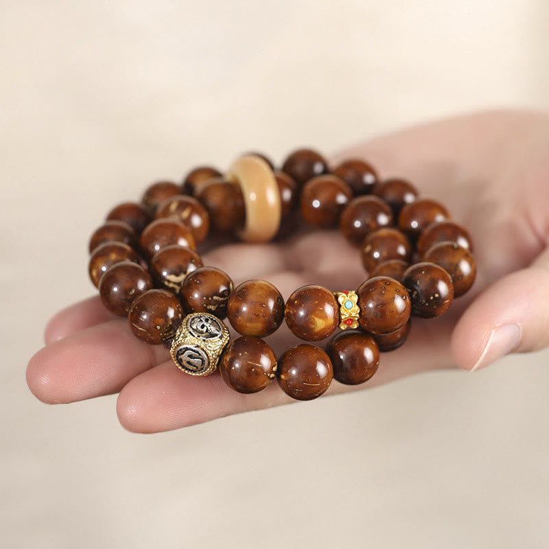 Doppelt gewickeltes spirituelles Armband mit Rattenreichtum und Bodhi-Samen in Lila und Gold