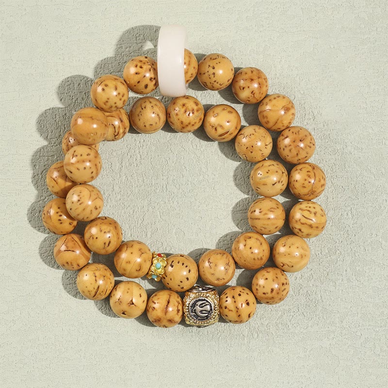 Doppelt gewickeltes spirituelles Armband mit Rattenreichtum und Bodhi-Samen in Lila und Gold