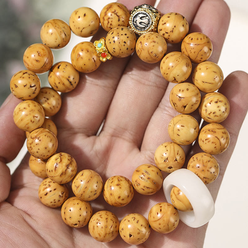 Doppelt gewickeltes spirituelles Armband mit Rattenreichtum und Bodhi-Samen in Lila und Gold