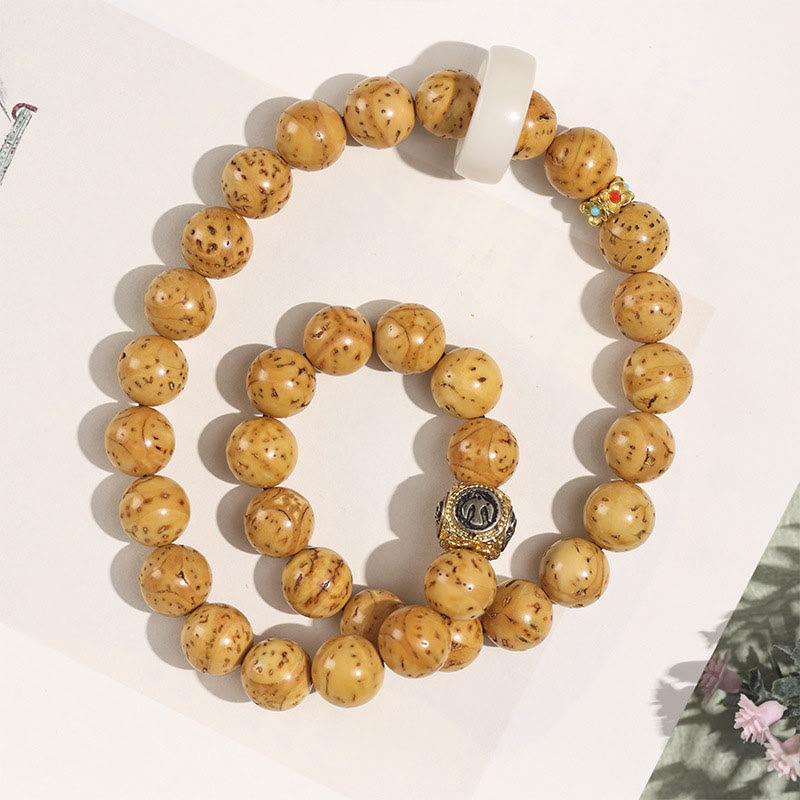 Doppelt gewickeltes spirituelles Armband mit Rattenreichtum und Bodhi-Samen in Lila und Gold