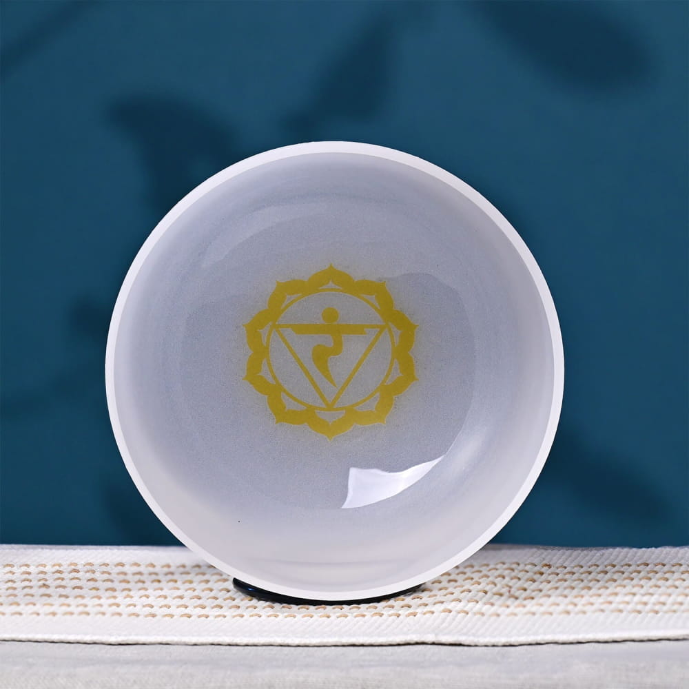 White ceramic bowl with yellow Solar Plexus Chakra symbol for meditation and healing