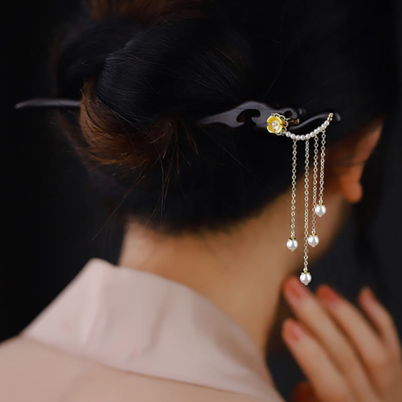 Chinesische Haarnadel aus Ebenholz mit gelben Perlenquasten