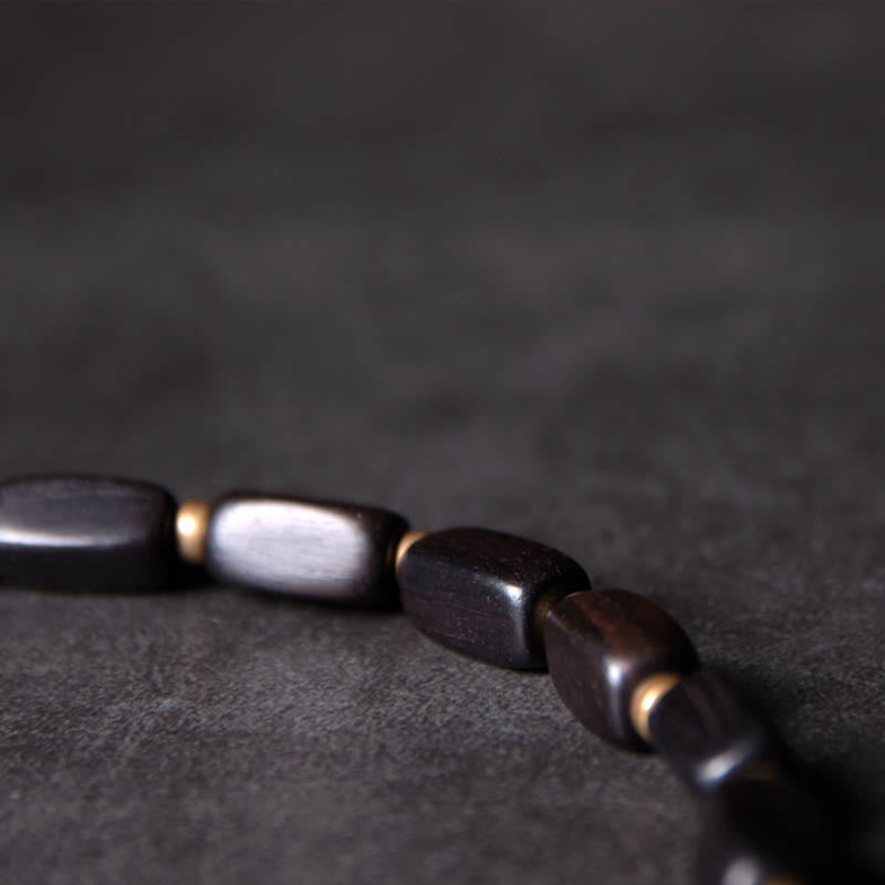 Doppelt gewickeltes Armband aus Ebenholz mit Dzi-Perlen für Balance