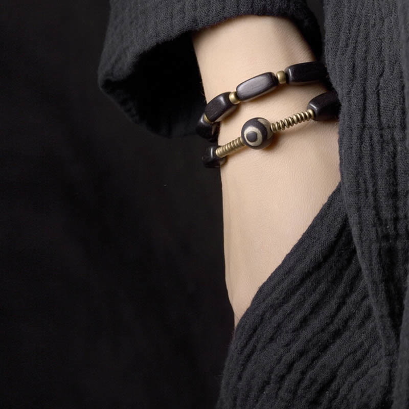 Doppelt gewickeltes Armband aus Ebenholz mit Dzi-Perlen für Balance