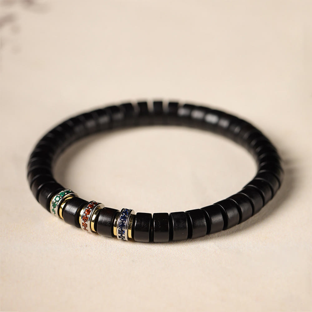 Peace-Armband aus Ebenholz mit kleinem Blatt aus rotem Sandelholz und Zirkon, Unisex