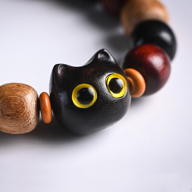 Schutzarmband aus Ebenholz mit kleinem Blatt-Charm aus rotem Sandelholz