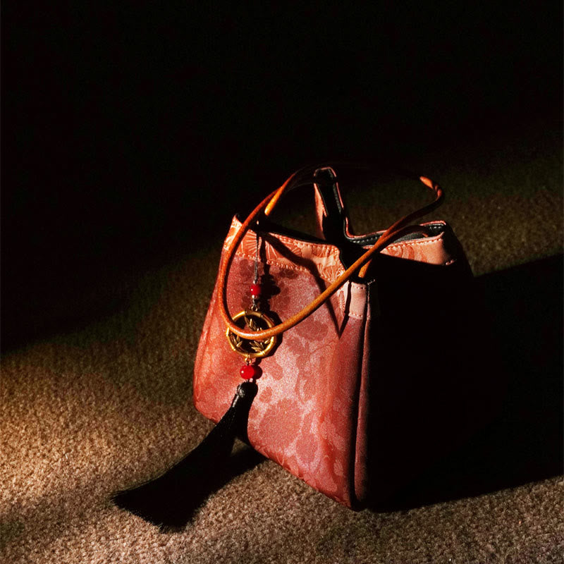 Bestickte Xiangyunsha-Seiden-Umhängetasche mit Bambus- und Pflaumenblüten