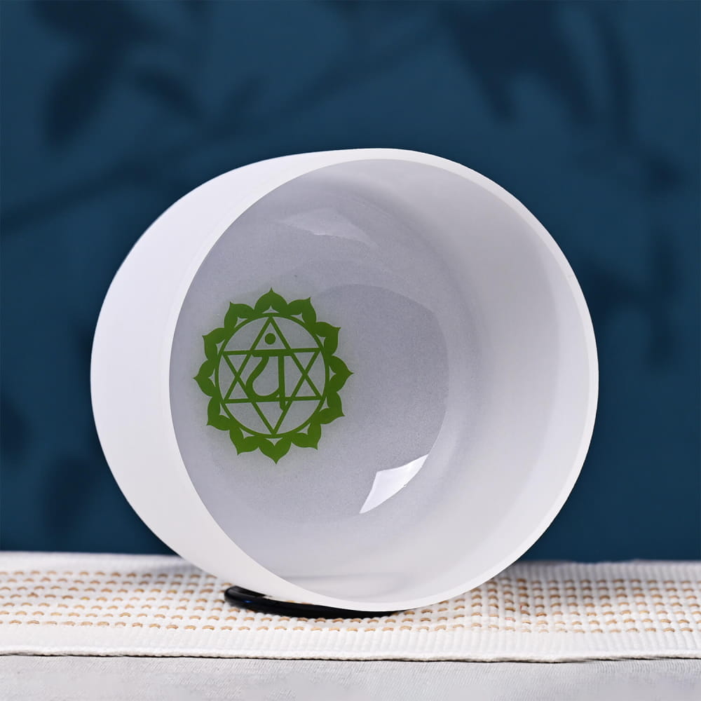 White ceramic bowl featuring green heart chakra symbol for healing and meditation