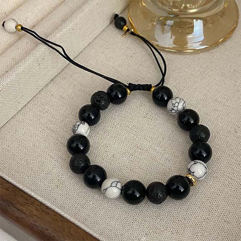 Schwarzes Obsidian-Lavastein-Yin-Yang-Armband für Stärke
