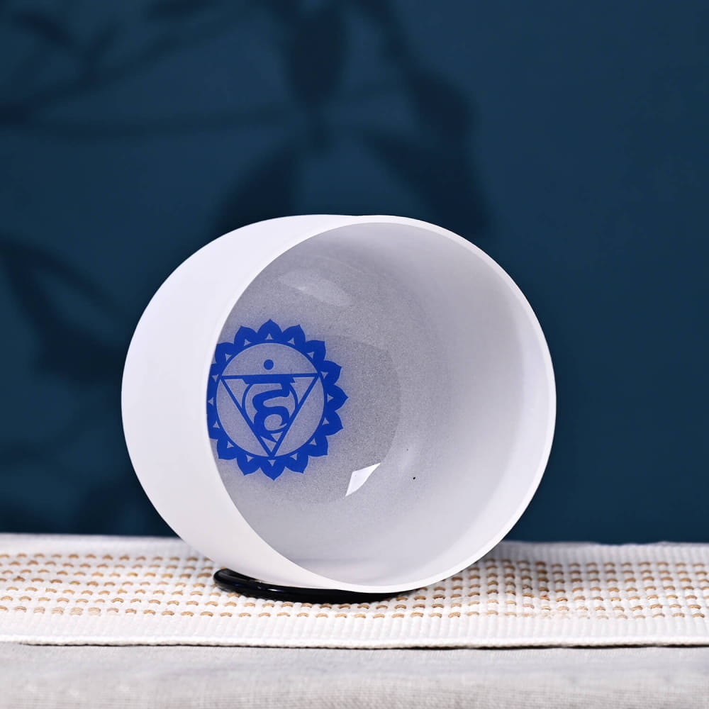 White ceramic bowl featuring blue Throat Chakra symbol for meditation and healing