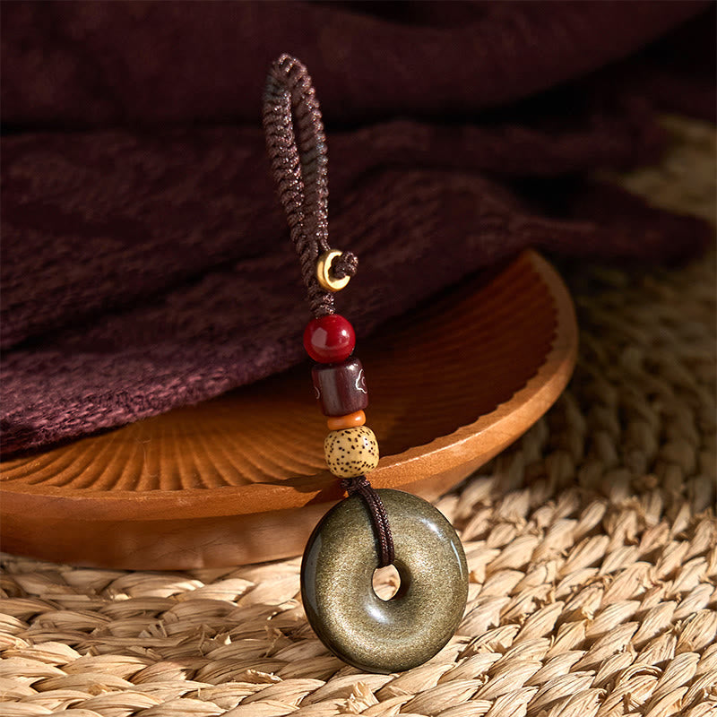 Goldglänzender Obsidian-Schlüsselanhänger mit Peace-Schnalle zum Schutz