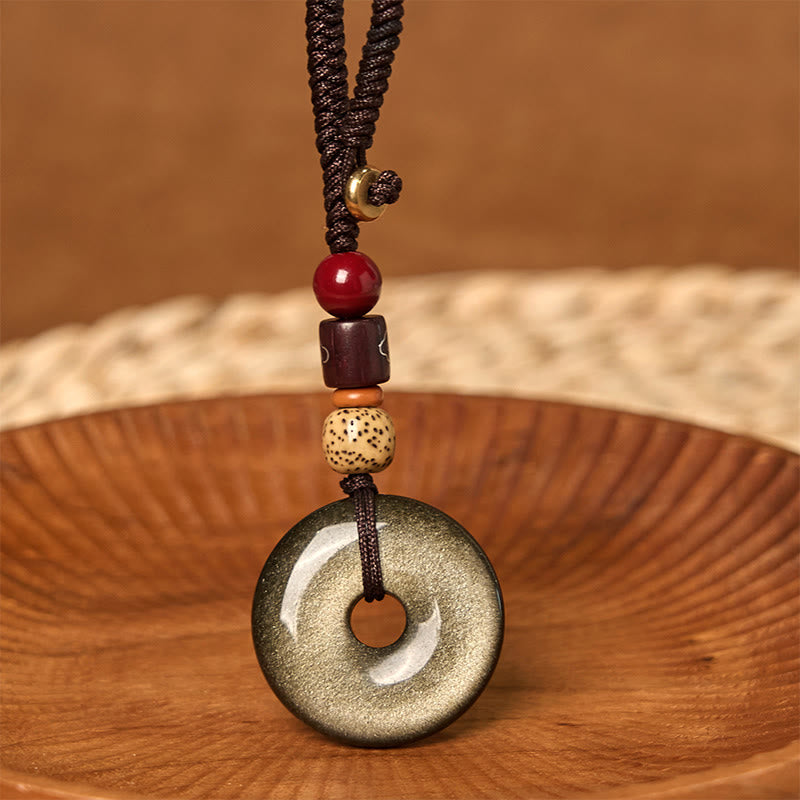 Goldglänzender Obsidian-Schlüsselanhänger mit Peace-Schnalle zum Schutz