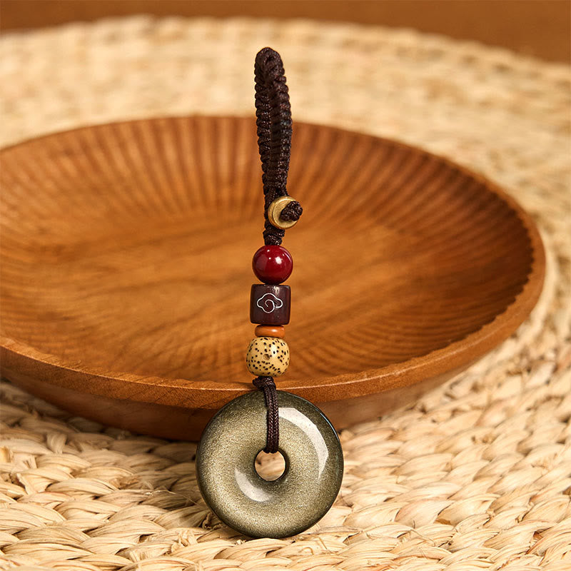 Goldglänzender Obsidian-Schlüsselanhänger mit Peace-Schnalle zum Schutz