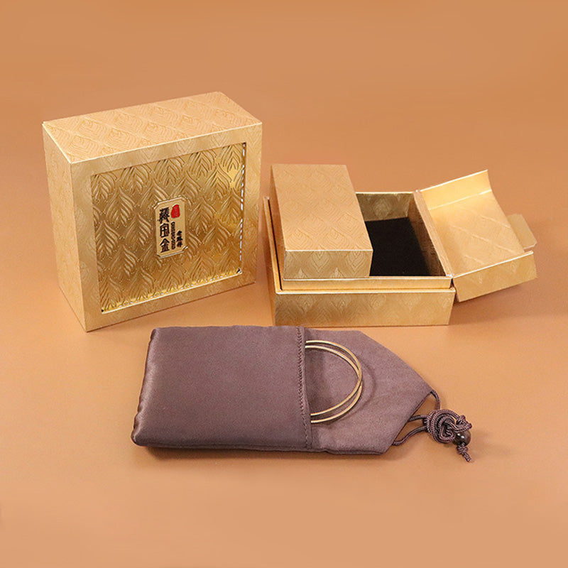 Goldene Zen-Schmuckaufbewahrungsbox mit Federmuster