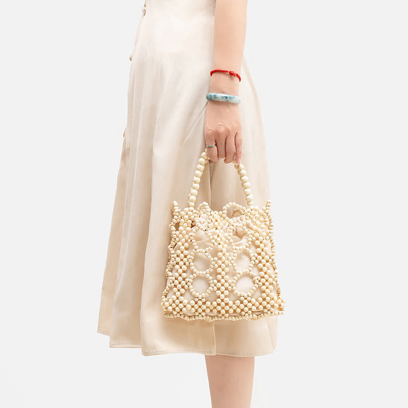 Handgewebte Handtasche mit runden, hohlen Holzperlen – Bohemian-Stil