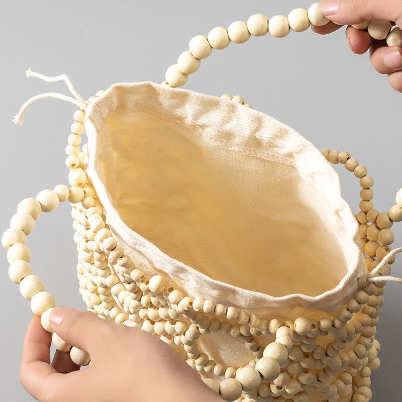 Handgewebte Handtasche mit runden, hohlen Holzperlen – Bohemian-Stil