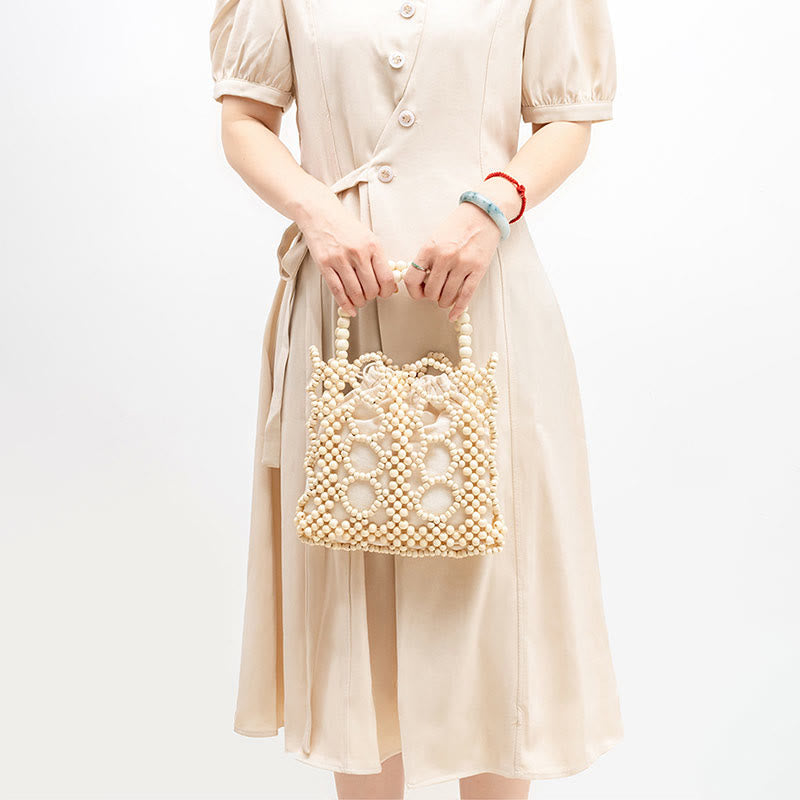 Handgewebte Handtasche mit runden, hohlen Holzperlen – Bohemian-Stil