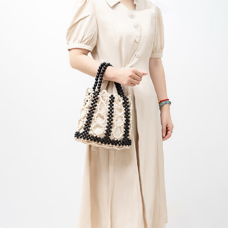 Handgewebte Handtasche mit runden, hohlen Holzperlen – Bohemian-Stil