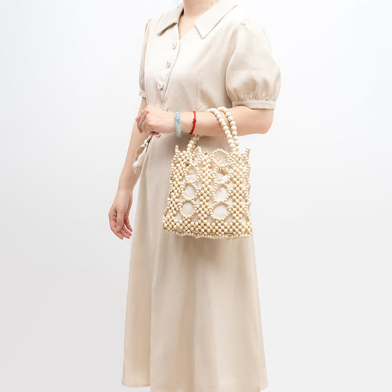 Handgewebte Handtasche mit runden, hohlen Holzperlen – Bohemian-Stil
